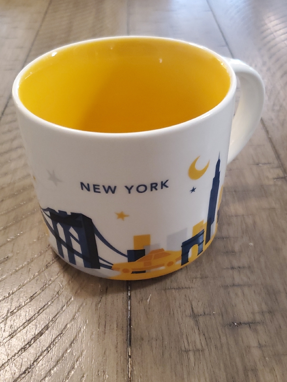 Starbucks New York Mug with Yellow Interior and Blue Cityscape